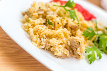 Delicious rice with pork meat and salad