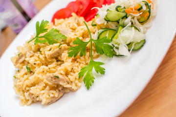 Delicious rice with pork meat and salad