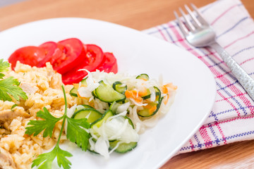 Delicious rice with pork meat and salad