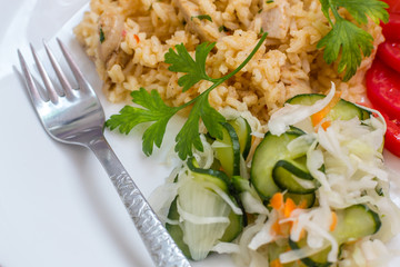 Delicious rice with pork meat and salad