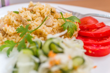 Delicious rice with pork meat and salad