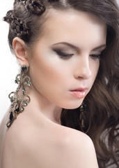 Young woman beauty portrait with earrings