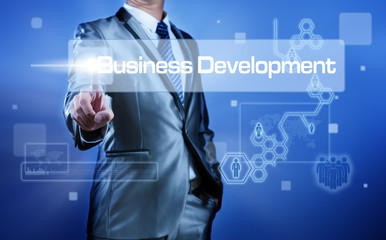 Business man with digital screen press on business development