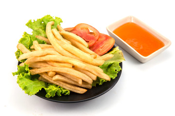 French fries with ketchup closeup isolated white background