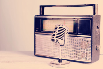 Vintage microphone and radio on table