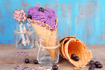 Tasty ice cream with berries in waffle cones