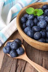 Wooden bowl of blueberries