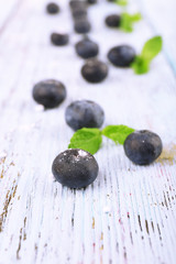 Fototapeta premium Blueberries on wooden background closeup