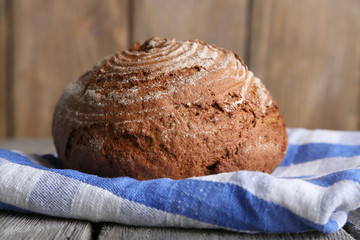 Fresh baked bread, on wooden background