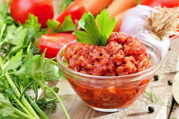 Homemade tomato sauce on rustic wooden table