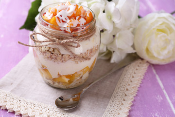 Healthy breakfast - yogurt with  fresh peach and muesli served