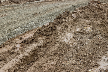 muddy road whith tire tracks imprinted