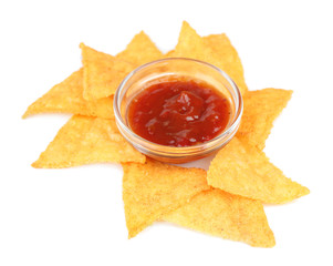 Tasty nachos and bowl with sauce isolated on white