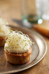 Individual carrot cake with sprouts