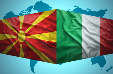 Waving Macedonian and Italian flags