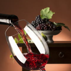 red wineglass with grapes
