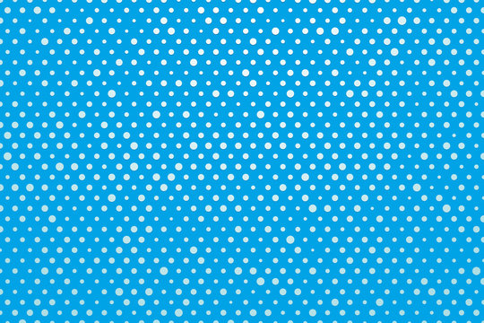blue background with white polka dots