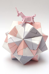 Origami unicorn riding paper ball