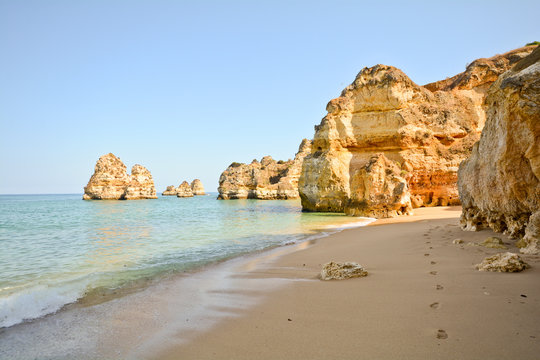 Praia do Camilo, Coast with cliffs and beach, Algarve Portugal