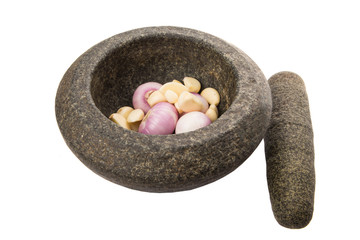 Stone mortar and pestle with onions and garlic 