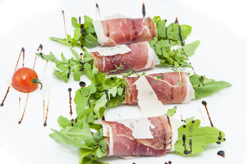 meat rolls with meat and greens on a table in a restaurant
