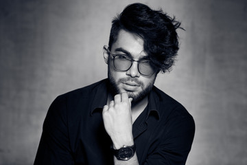 sexy fashion man model dressed casual wearing glasses posing