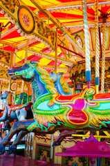 Fototapeta premium View of Carousel with horses on a carnival Merry Go Round
