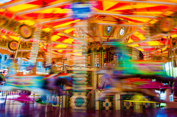 View of Carousel with horses on a carnival Merry Go Round