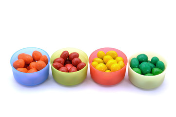 Various Color Of Chocolate Beans In Plastic Container 