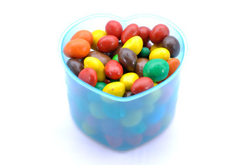 Various Color Of Chocolate Beans In Plastic Container 