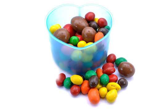 Various Color Of Chocolate Beans In Plastic Container 