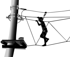 boy in adventure park rope ladder