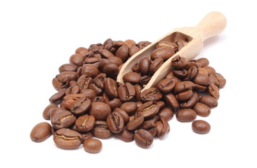 Heap of coffee on wooden spoon. White background