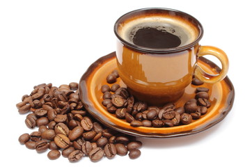 Heap of coffee grains and cup of beverage