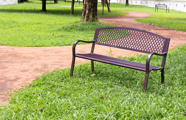 wooden park bench at the public park image
