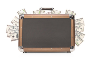Studio shot of a briefcase full of cash