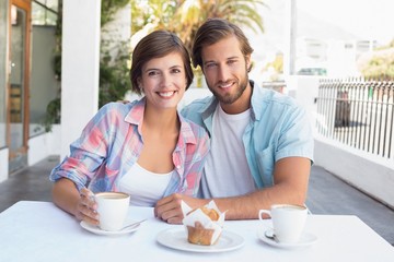 Obraz na płótnie Canvas Happy couple enjoying coffee together