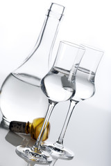 Clear spirit in carafe and glasses
