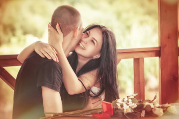 Fototapeta premium Love and affection between a young couple at the park