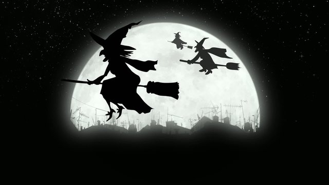 Witches flying over the city at night.