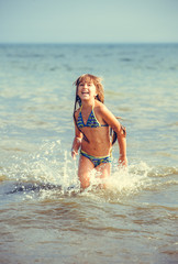 Fototapeta na wymiar happy girl in the sea