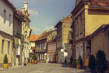 Medieval houses and promenade alley in Brasov city, Romania