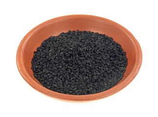 Small bowl of black caraway seeds