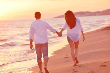 young couple  on beach have fun