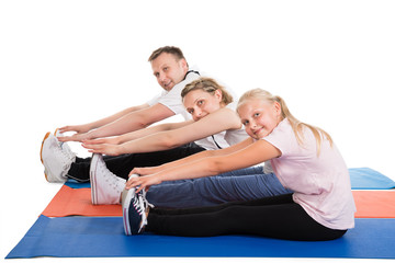 Young Family Doing Stretching Exercises