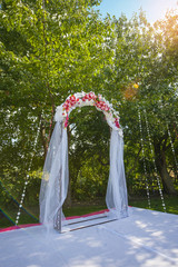 Fototapeta premium Arch for the wedding ceremony. Floristic composition in vintage