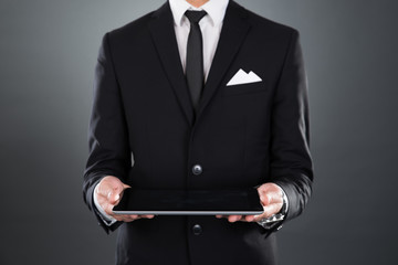 Businessman Holding Digital Tablet