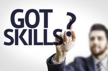 Business man pointing the text: Got Skills?