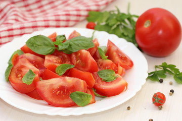 Salad with fresh tomatoes and greens