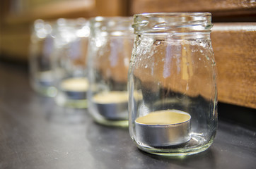 Candles in jars on the windowsill